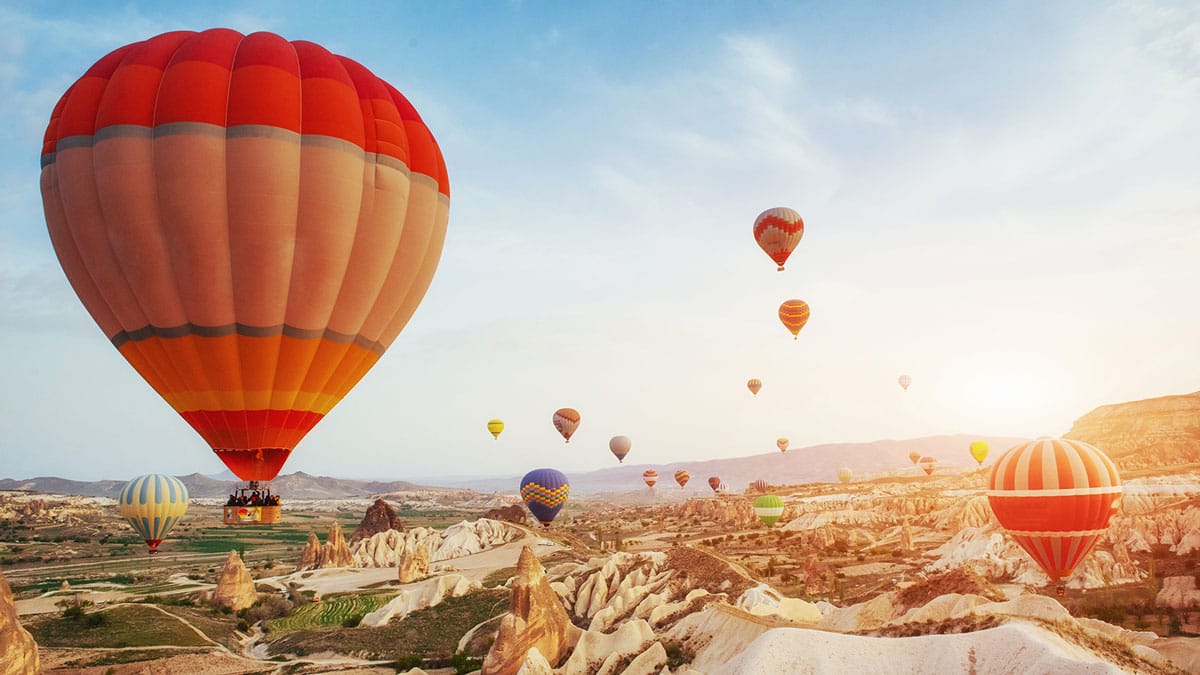 hot air balloon flying rock landscape turkey cappadocia 2025